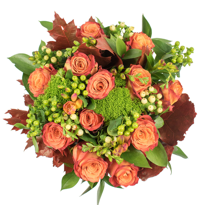 A top-down view captures an abundant, autumn-inspired bouquet arranged on a stark white surface, the composition dense and deliberate so that each element reads clearly. The dominant sight is a field of full-blown roses, their petals graduating from warm peach at the heart through coral and deep orange to outer rims kissed with a rusted red - a layered colour story that mirrors a late-September canopy. Interspersed with these classic roses are vivid clumps of green trick dianthus, those velvety, brain-like spheres that bring a plush texture and a springy, mossy green note to the design. Waxy Hypericum berries provide lively punctuation: some shine bright lime, others rest pale and creamy, offering small luminous points among the petals. Lush, broad green foliage fills negative space while larger, lobed leaves in rich burgundy and burnt orange are strategically placed like autumn leaves caught in the bouquet, giving weight and seasonal authenticity. The overall shape is circular and compact, crafted so light skims the petal ribs and bounces softly off the berries, casting gentle shadows that read as depth rather than clutter. This arrangement is conceived for intimate autumn interiors - a centrepiece for a Kennington dinner table, a thoughtful gift after a weekend at the nearby farmers' market on Kennington Road, or a seasonal accent for a flat by the Oval. The combination of velvety roses, mossy green textures and glossy berries suggests a subtle, earthy fragrance; the effect is generous, comforting and unmistakably of the season.
